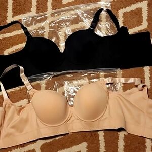 New 2 womens bras. Size 38C. Black and cream. Never worn. Thick straps. Nice!